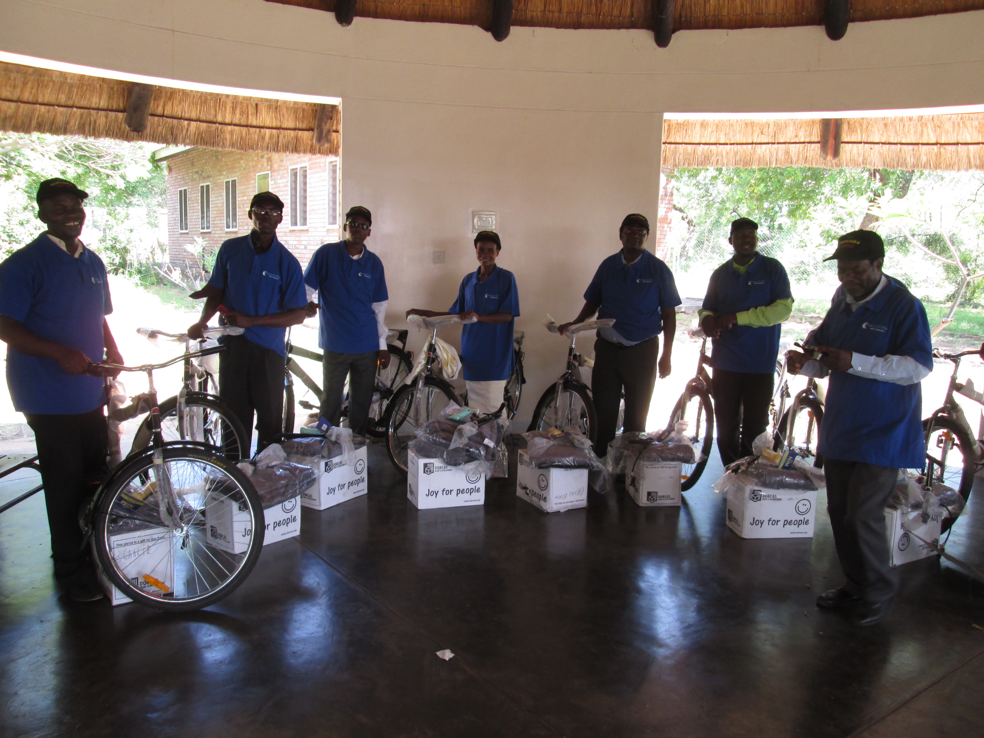 Translation team receiving bicycles and laptops
